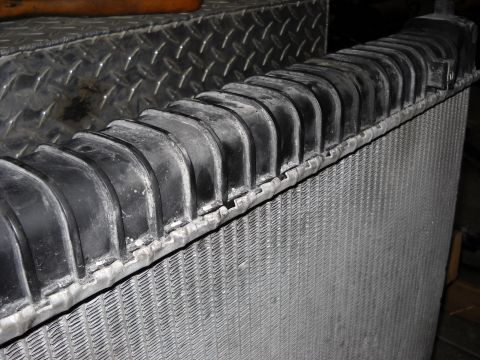 1986 Ford C-350 (Centurion Conversions) - Radiator part shown in detail, likely for a truck or heavy equipment.