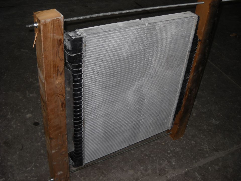Radiator held by wooden supports