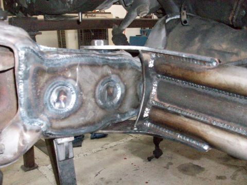 1996 Ford Bronco - Close-up of heavily welded frame components, showing metal fabrication work.
