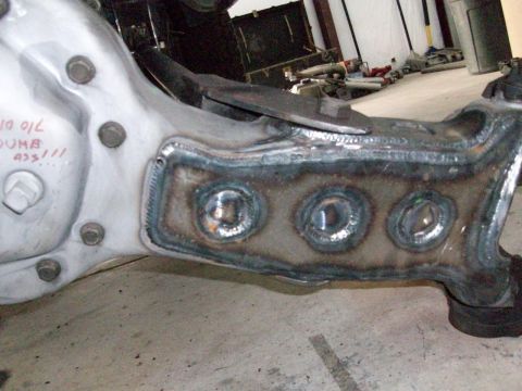1996 Ford Bronco - A suspension part shows recent welding work and handwritten markings.