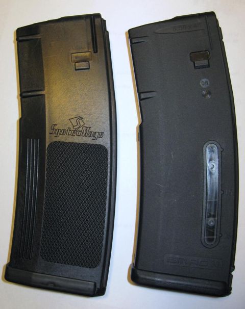 2000 Ford Crown Victoria - Two black rifle magazines are shown side-by-side. The left magazine features the 'SyndicateMags' logo and a textured grip area.
