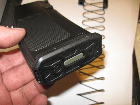 2000 Ford Crown Victoria - Close-up of a gun magazine, with a spring visible in the background.