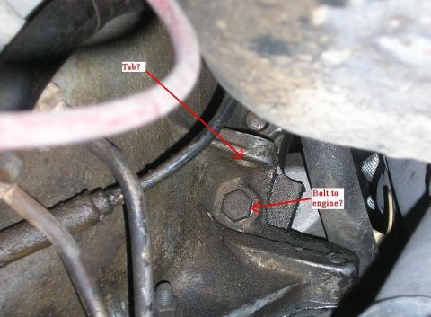 1979 Chevrolet C/K Pickup - Engine component detail with arrows indicating a tab and a bolt connection point.