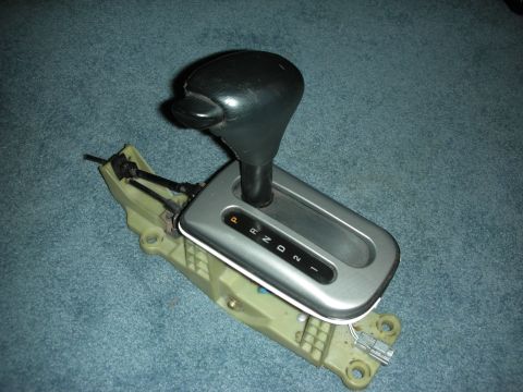 1998 Ford Crown Victoria - A car's automatic transmission shifter assembly is shown removed from its vehicle.