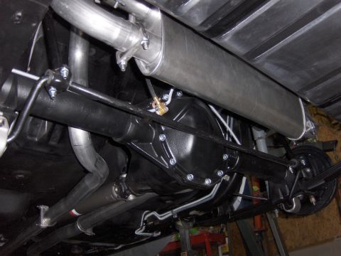 1970 Chevrolet Camaro - Close-up of the rear axle and exhaust components on a vehicle's underside.