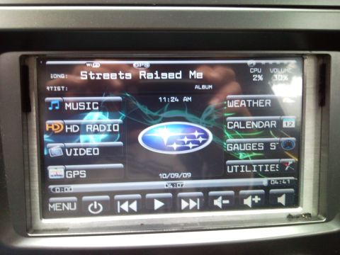 2007 Subaru Impreza - The car's infotainment system displays the date 10/09/09 and various media and utility options.