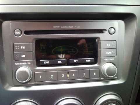 2007 Subaru Impreza - Car stereo unit with radio and CD changer functions, displaying the Subaru emblem.