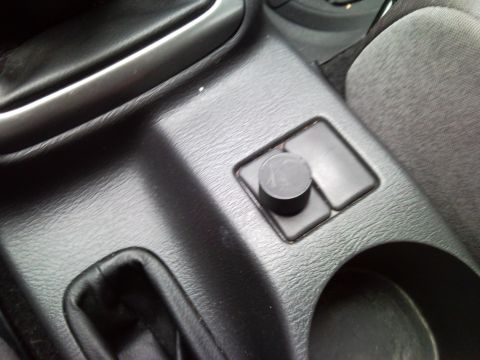 2007 Subaru Impreza - Interior view of a car's center console, showing a knob and buttons.