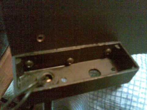 2003 Ford Crown Victoria - three 6-32 buttonhead screws slightly offset for stability hold on the maplight housing with no bracket
