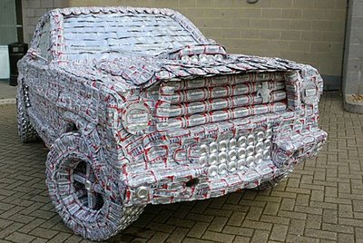 1978 Ford Mustang II - This unique vehicle appears to be constructed entirely from aluminum beer cans, creating a mosaic of silver and red.