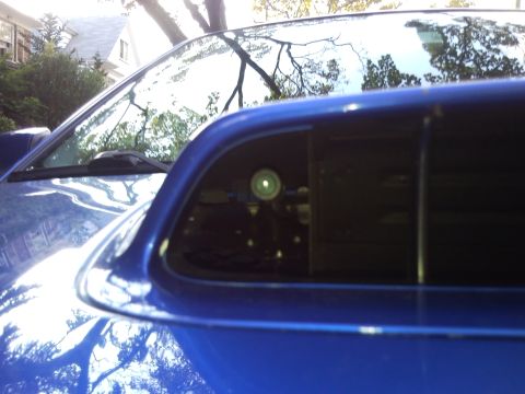 2007 Subaru Impreza - Close-up of a blue Subaru Impreza's hood scoop, revealing a camera mounted within.