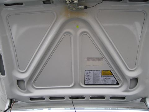 1991 Ford LTD Crown Victoria - Under the hood, showing the bracing and a sticker with jacking instructions.