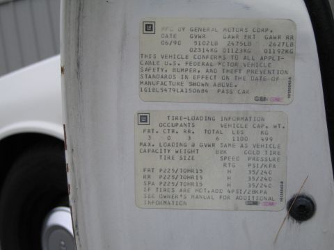 1991 Ford LTD Crown Victoria - GM door-jamb certification label with manufacture date, GVWR/GAWR, VIN and tire-loading data.