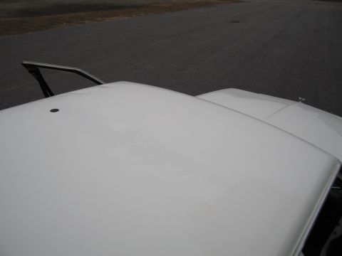 1991 Ford LTD Crown Victoria - The tops of two white vehicles are visible, with one having a partially open driver's side door.