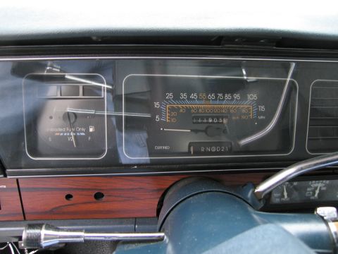 1991 Ford LTD Crown Victoria - Close-up of a car's instrument cluster, a fuel gauge and odometer reading 44,905 miles.