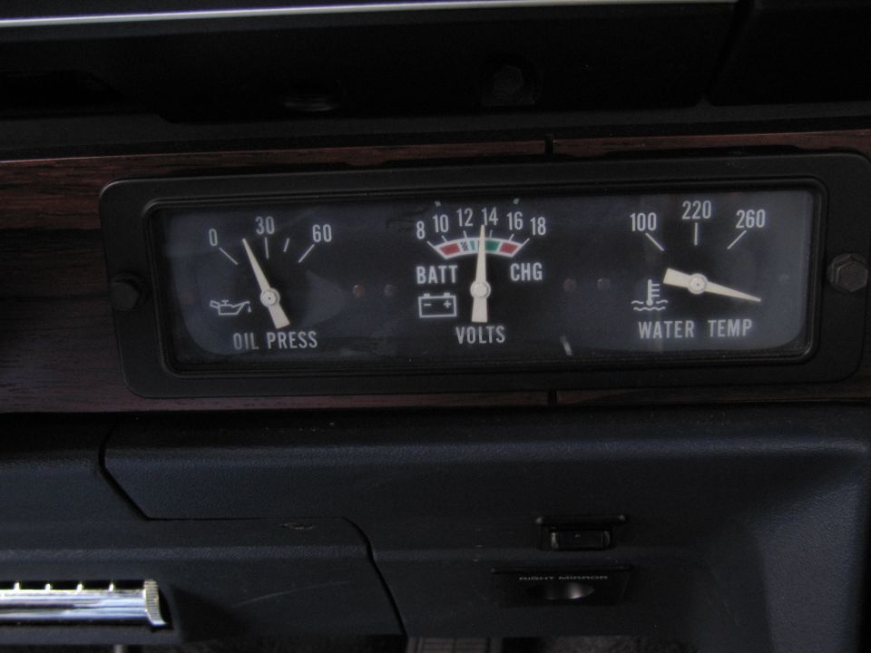 Dashboard gauges showing oil pressure, volts, and water temperature