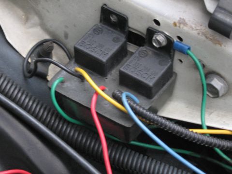 1991 Ford LTD Crown Victoria - Close-up of Bosch relays and wiring in a vehicle's engine bay.