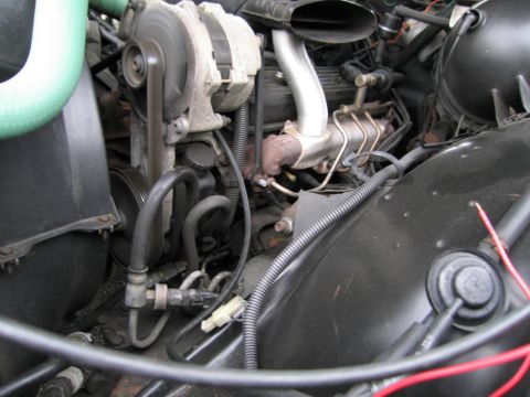 1991 Ford LTD Crown Victoria - Engine bay of a 1991 Ford Crown Victoria LTD, displaying various mechanical components and wiring harnesses.