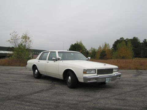 1991 Ford LTD Crown Victoria - This sedan has a distinctive grille and body style from the 1980s.