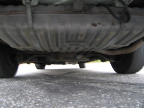 1991 Ford LTD Crown Victoria - Underside view of a car, showing the fuel tank and exhaust components.