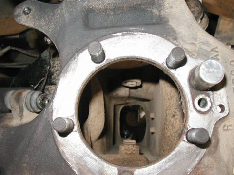 1995 Ford Bronco - looking down through the knuckle (spindle removed and axleshaft out). Note the ABS senso on the right of the knuckle bolt pattern.
