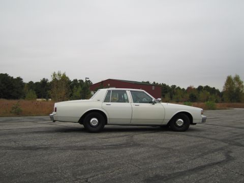 1991 Ford LTD Crown Victoria - This 1991 Chevrolet Caprice sedan is shown from the side in an open lot.