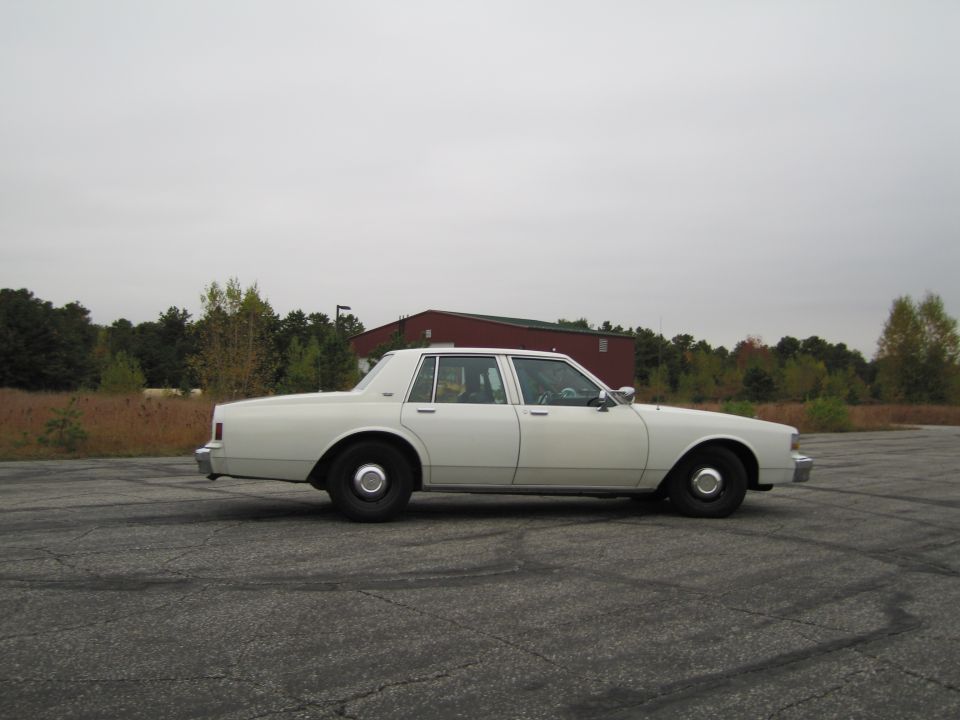 White 1991 Chevrolet Caprice sedan, side view