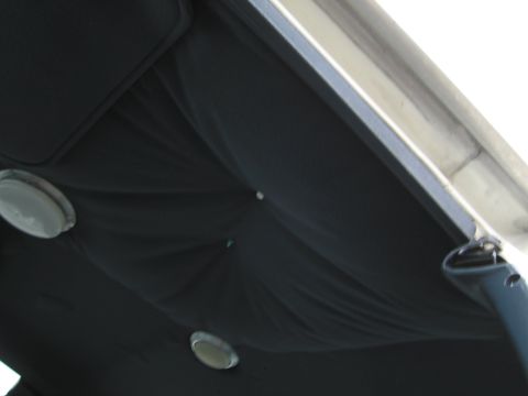 1991 Ford LTD Crown Victoria - Interior view of a vehicle's headliner, showing dome lights and fabric texture.
