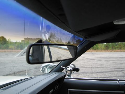 1991 Ford LTD Crown Victoria - Interior view from driver's seat, looking out the windshield and side window.