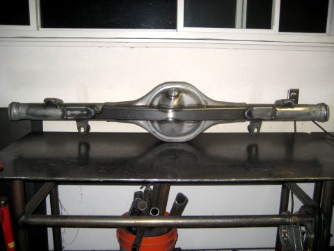 1996 Ford Bronco - Custom rear axle assembly on a workbench, ready for fabrication or installation.