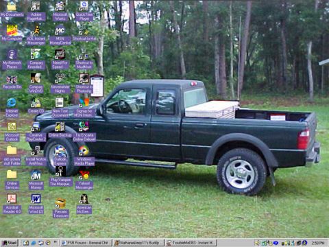 1985 Ford Bronco - Pickup truck on grass with Windows XP desktop icons overlayed. Likely a Ford Ranger.