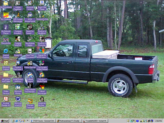 Dark green pickup truck parked on grass, toolbox in bed. Windows XP desktop icons visible