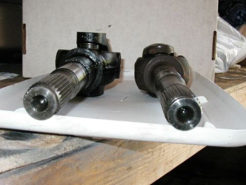 1995 Ford Bronco - Two driveshaft U-joints are shown, one appearing larger than the other.