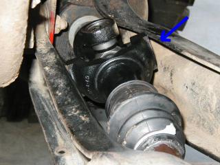 1995 Ford Bronco - Close-up view of a vehicle's driveshaft universal joint assembly.