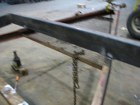 1900 Ford C-350 (Centurion Conversions) - Trailer frame and components, including a chain and a jack.