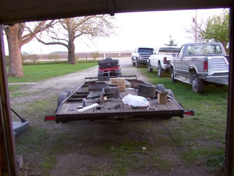 1900 Ford C-350 (Centurion Conversions) - Trailer and vehicles parked in a yard.