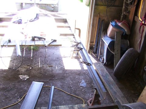 1900 Ford C-350 (Centurion Conversions) - Metal fabrication in progress within a workshop setting, showing tools and materials.
