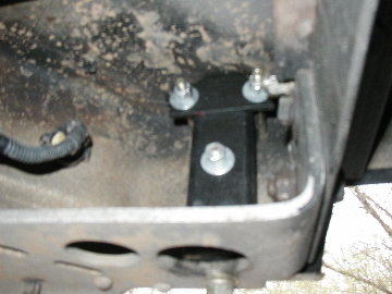 1995 Ford Bronco - That middle bolt is only there as a "pin" to ensure the gas can stays in the receiver. The whole assembly can be pulled from the receiver i…