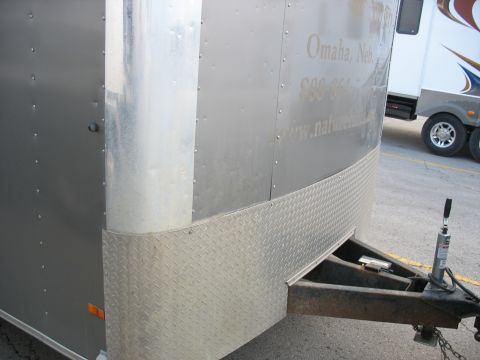 1900 Ford C-350 (Centurion Conversions) - A silver enclosed trailer is parked next to another recreational vehicle.