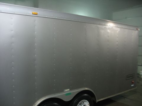 1900 Ford C-350 (Centurion Conversions) - Silver enclosed trailer with visible rivets and marker lights, seen from the side.