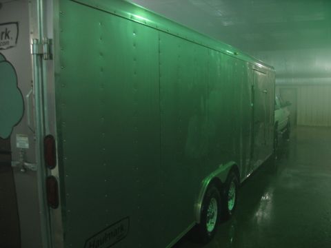 1900 Ford C-350 (Centurion Conversions) - A pickup truck is parked inside a large enclosed trailer.