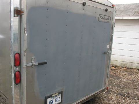 1900 Ford C-350 (Centurion Conversions) - Cargo trailer rear doors showing Haulmark branding and a Nebraska license plate.