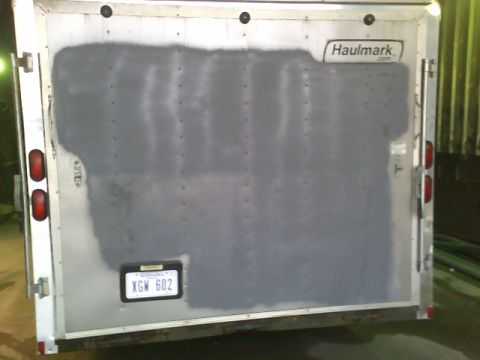 1900 Ford C-350 (Centurion Conversions) - Rear view of a trailer with a 'Haulmark' logo and a license plate.