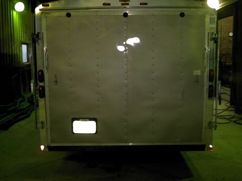 1900 Ford C-350 (Centurion Conversions) - Silver cargo trailer rear view, double doors and trailer lights.