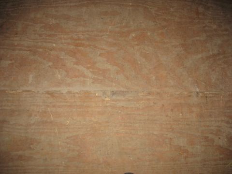 1900 Ford C-350 (Centurion Conversions) - Close-up view of a wood grain texture, showing horizontal lines and surface imperfections.