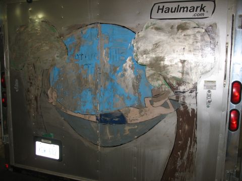 1900 Ford C-350 (Centurion Conversions) - Rear view of a Haulmark trailer a painted mural and a license plate.