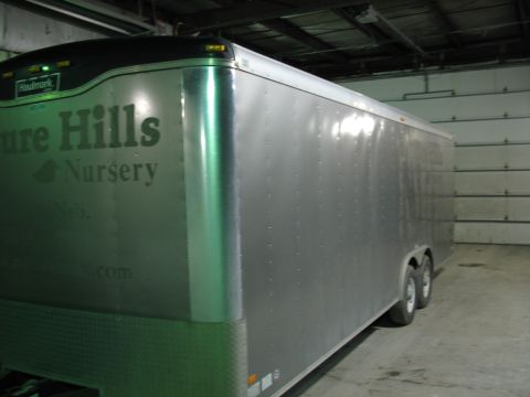 1900 Ford C-350 (Centurion Conversions) - Enclosed cargo trailer with 'Pure Hills Nursery' text and 'Haulmark' logo visible on the side.