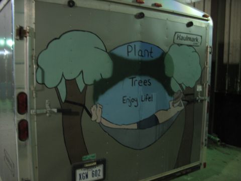 1900 Ford C-350 (Centurion Conversions) - This trailer features a mural with text and a license plate.