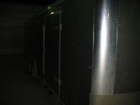 1900 Ford C-350 (Centurion Conversions) - Dark enclosed trailer with a side door and diamond plate corner detail.