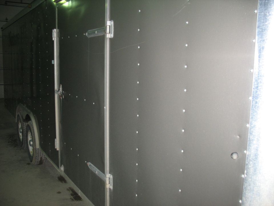 Side view of an enclosed cargo trailer with double doors